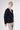 Side view of Erro Cashmere Cardigan Beluga highlighting relaxed drape and refined proportions.