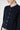 Soft Italian cashmere detail – close up of Ginan Cashmere Cardigan Beluga round neckline, fine knit texture and tonal buttons.