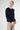 Premium cashmere cardigan women – side view of Ginan Cashmere Cardigan Beluga in deep navy Italian knitwear.
