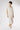 Champagne silk satin midi skirt styled with light knitwear, refined minimalist outfit