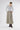 Drizzle grey suede maxi skirt styled with long sleeve top and leather boots, modern minimalist outfit