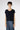 Front view of the Hamlet Cashmere Pullover Beluga in deep navy, highlighting its relaxed silhouette and elegant round neckline.