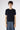 Front view of the Magda Cashmere Pullover Beluga in deep navy, highlighting its clean silhouette and refined short sleeve design.