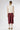 Midi heavy silk satin skirt Bordeaux Garnet – back view with fluid silhouette
