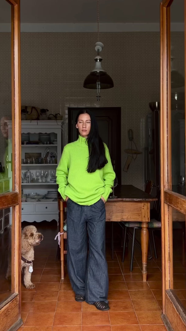 Model wearing Basilia Cashmere Turtleneck in Lime Glow, showing texture and fit